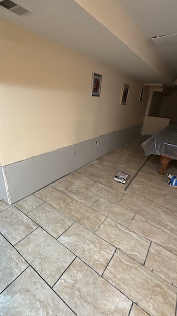 Lower interior wall replaced with new drywall
